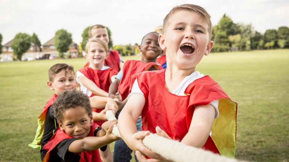 Children playing tug of war