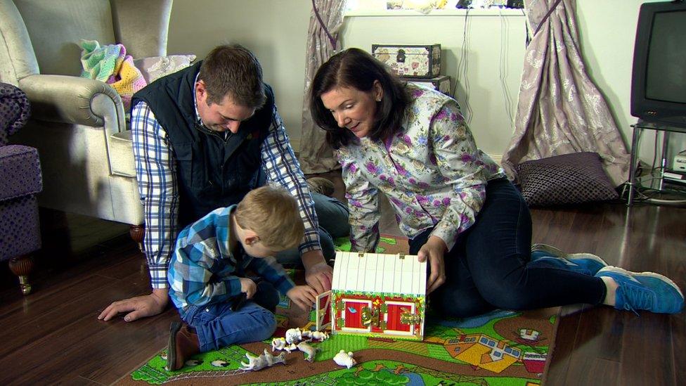 Lewis McIlroy with his mother and father