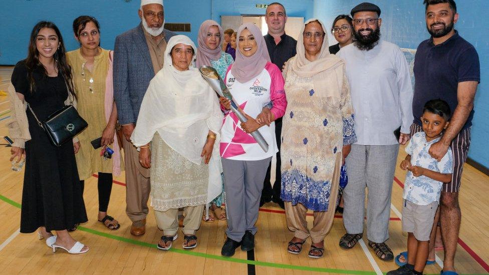 Rukia Bi takes part in The Queen's Baton Relay