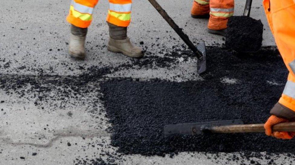 Men repairing a road