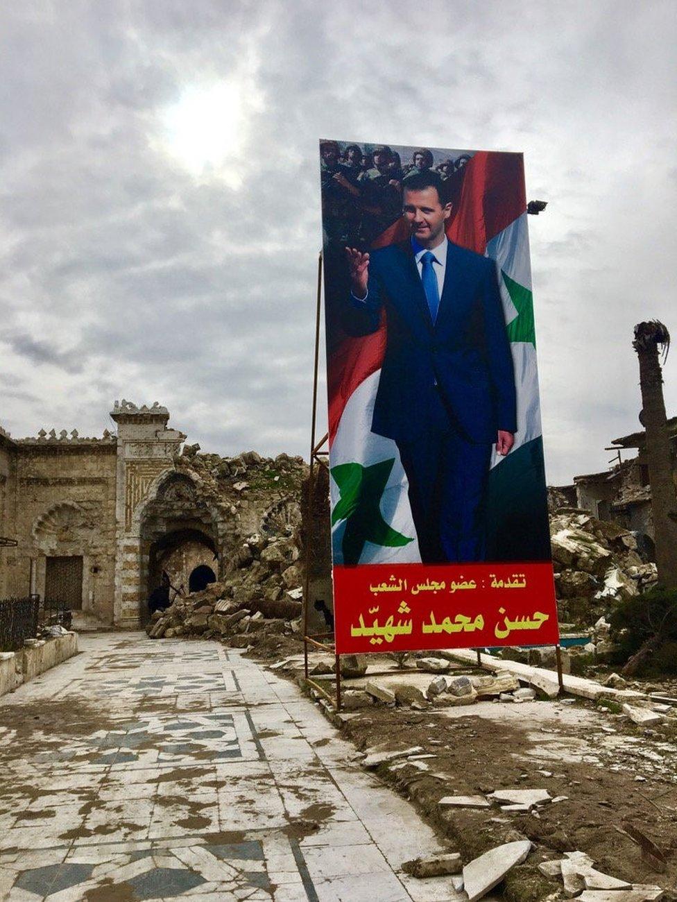 A poster of President Bashar al-Assad at the entrance to the Umayyad mosque