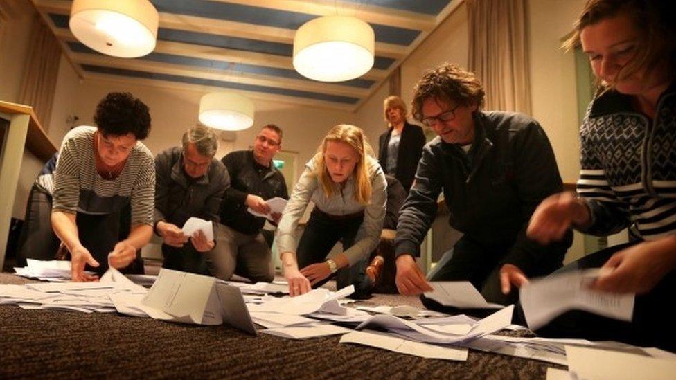 Officials count the votes of the Dutch referendum about the association agreement between the EU and Ukraine, in Schiermonnikoo