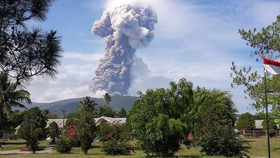 Plumes of hot ash from Mount Soputan loom over the Minahasa area in north Sulawesi