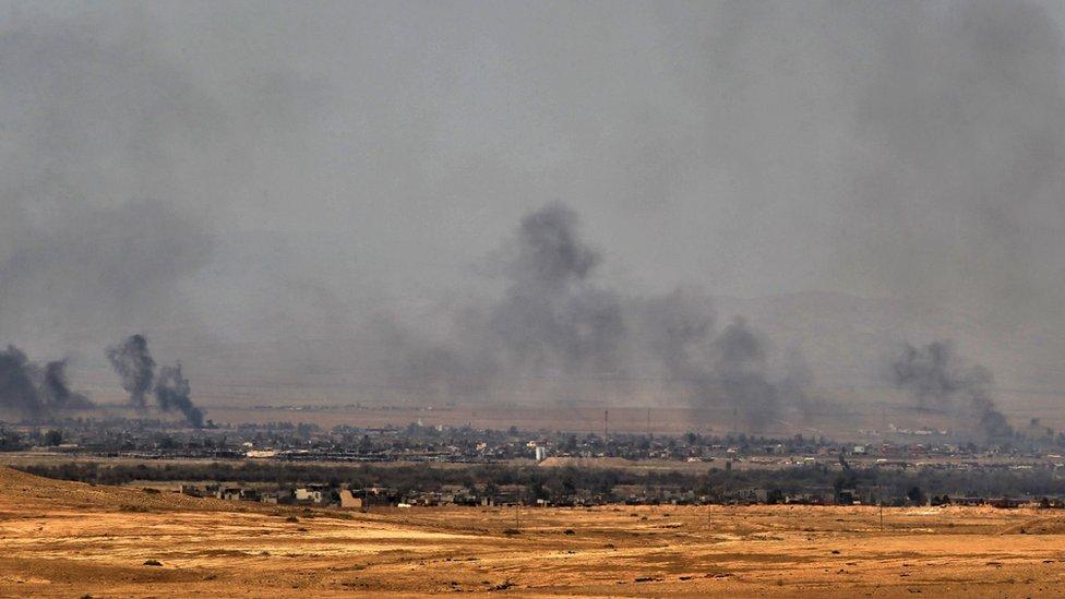 Smoke rises from Tal Afar during fighting between Iraqi forces and Islamic State militants (21 August 2017)