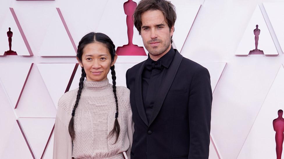 Chloe Zhao and Joshua James Richards at the Oscars