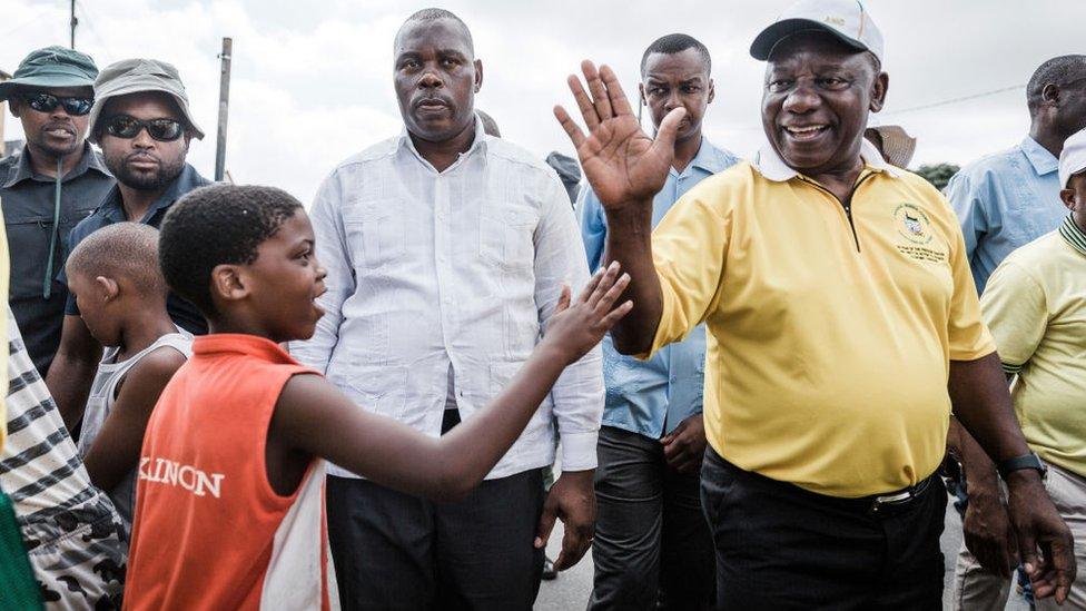 South African President and president of the ruling party, the African National Congress (ANC) Cyril Ramaphosa visits local residents during a door to door campaign visit in Clermont township, on March 31, 2019