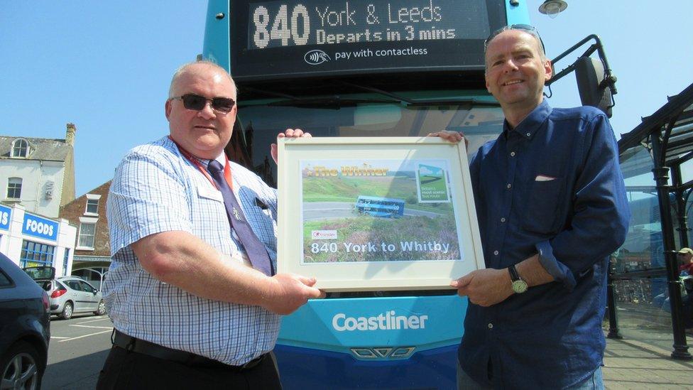 Paul Kirby (right) presents the award to Transdev's Colin Booth