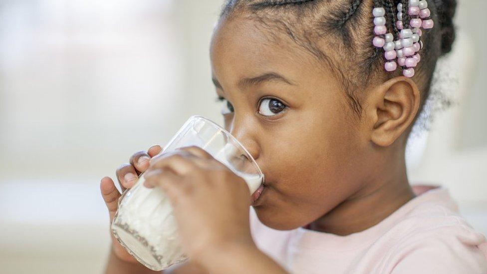 Girl drinking milk from glass