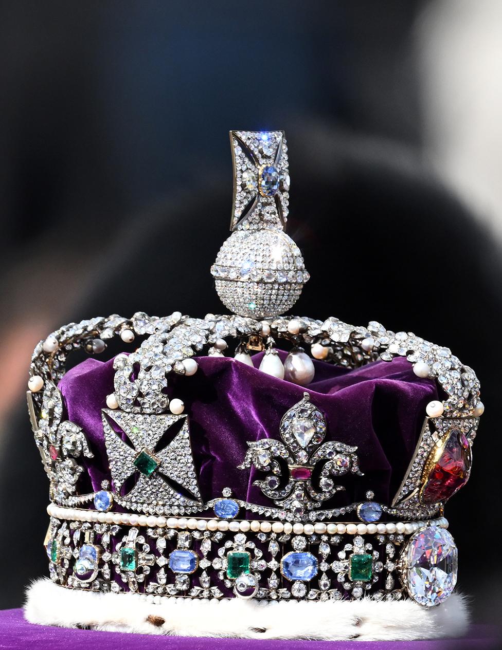 King Charles III and members of the royal family behind Queen Elizabeth II's flag-draped coffin as it is taken in procession on a Gun Carriage of The King's Troop Royal Horse Artillery from Buckingham Palace to Westminster Hall on 14 September 2022