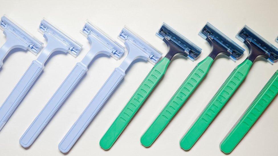 Men's razors and women's razors laid out together