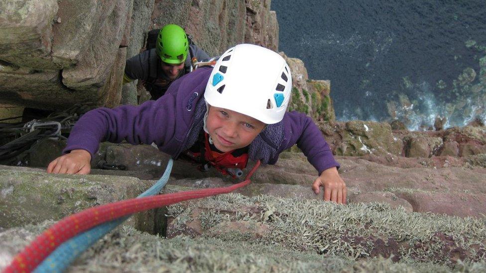 Edward Mills climbing