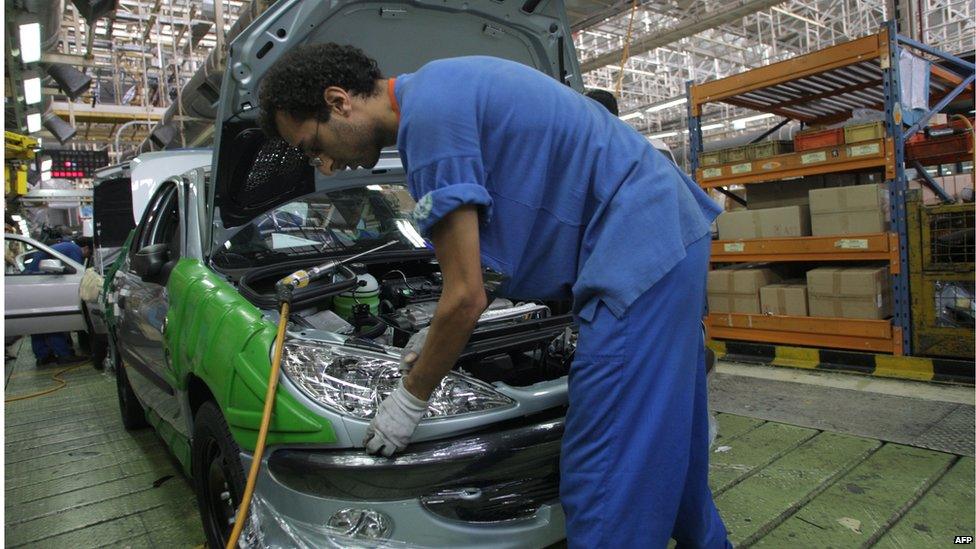 Iranian worker at a car factory west of Tehran (file photo)