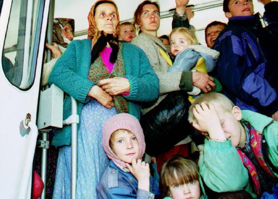 File photo shows refugees from Srebrenica arriving in Tuzla