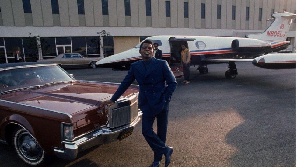 James Brown poses with his Learjet at Los Angeles International Airport in 1969