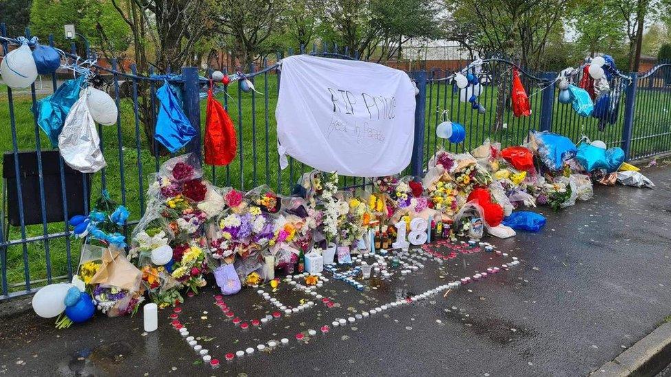 Tributes have been left at Millenium Park in Moss Side near where Prince Walker was killed