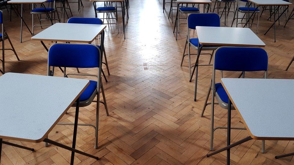 exam hall full of empty desks