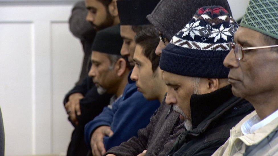 Mourners at funeral