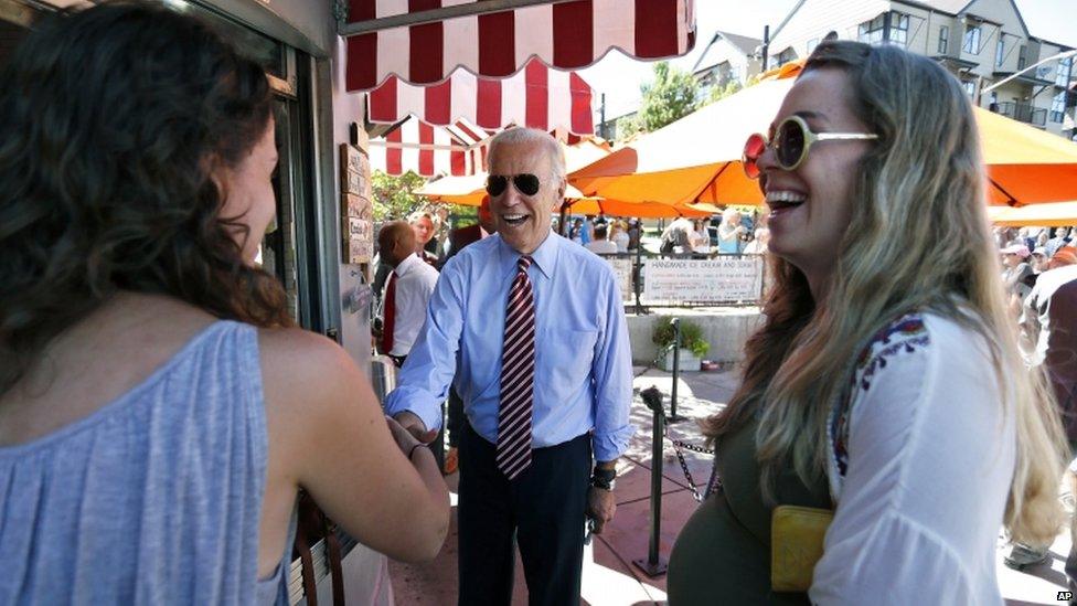 Vice President Joe Biden greets customers during a visit to Little Man Ice Cream, in Denver, on 21 July 2015