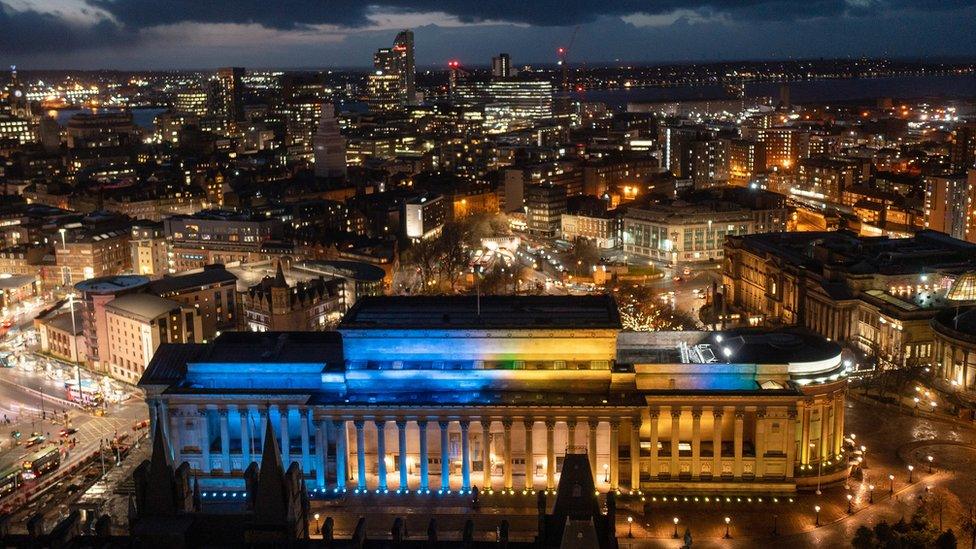 Liverpool's historic St George's Hall is illuminated in yellow and blue in support and solidarity with the people of Ukraine on February 24, 2022