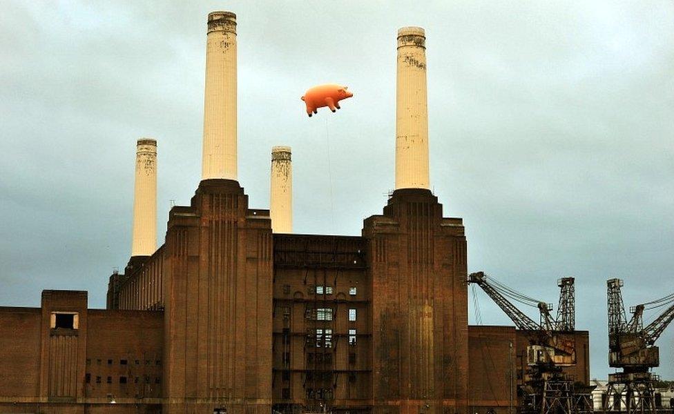 A giant inflatable pig flies above Battersea Power Station