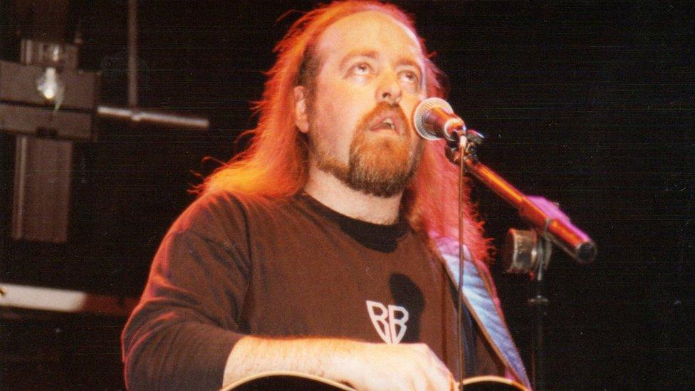 Bill Bailey performs on stage at the Leicester Comedy Festival in 1997