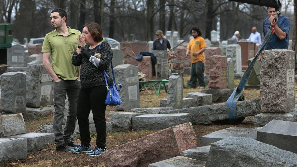 Mourners visit the vandalised Chesed Shel Emeth Cemetery in St Louis, Missouri, 21 February 2017