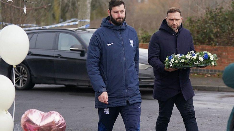 Birmingham City Football Club head coach John Eustace (right) laying flowers near to the scene