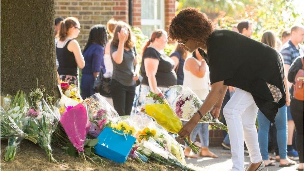 People leave flowers and tributes at the scene of the crash in Penge