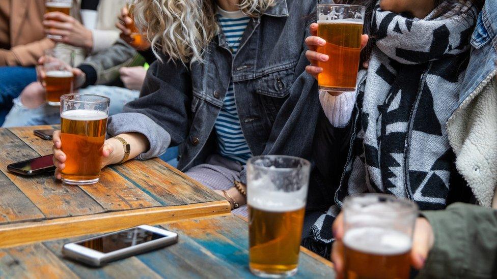 Stock image of people at a pub