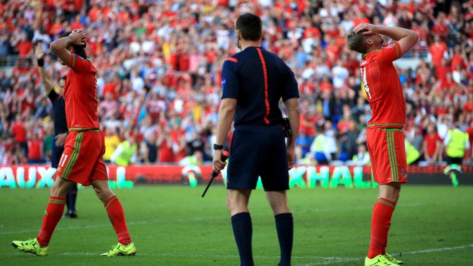 Wales players distraught after disallowed goal