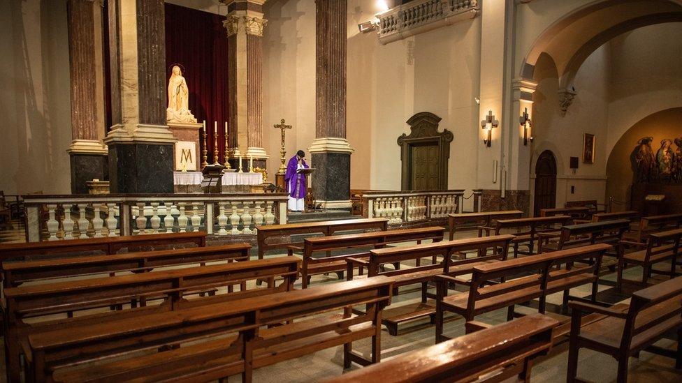 Priest Carlos Enrique Leal offers Mass via YouTube to parishioners at an empty Santa Maria de Betlem church on March 15, 2020 in Barcelona, Spain