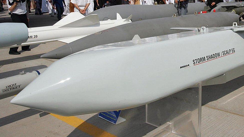 Emirati and foreign visitors pass behind the French made Storm Shadow/Scalp EG cruise missiles at the opening of the five-day Dubai Air Show in Dubai 20 November 2005.