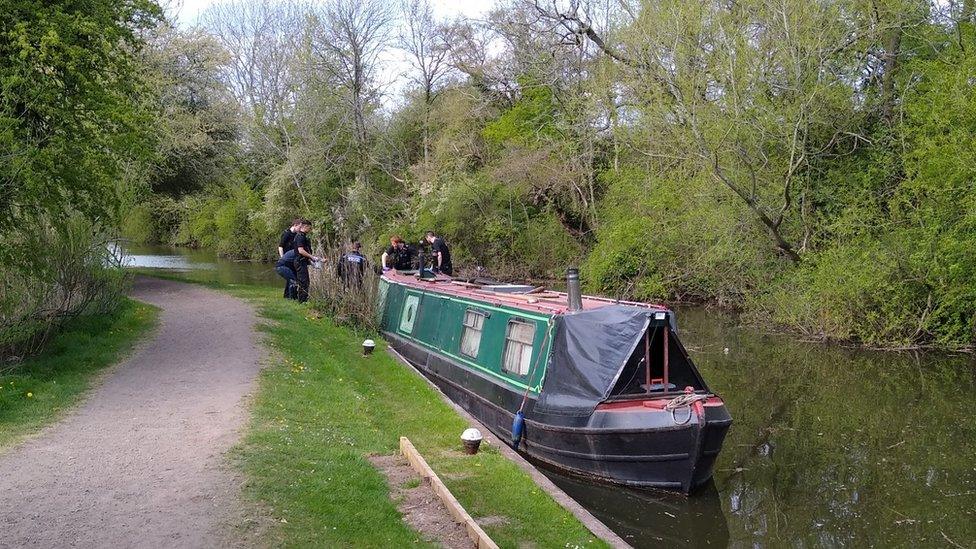 Narrowboat and police officers