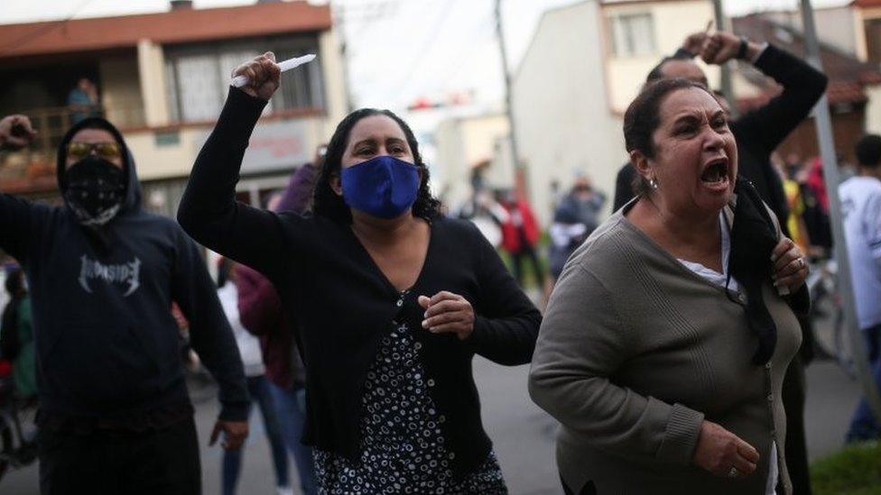 People protest outside a police station after a man, who was detained for violating social distancing rules, died from being repeatedly shocked with a stun gun by officers, according to authorities, in Bogota, Colombia September 9, 2020.