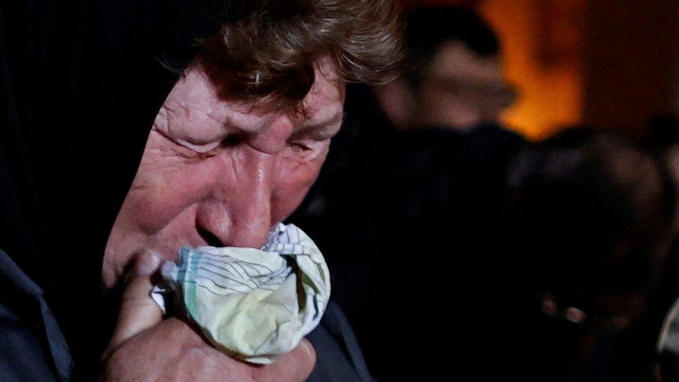 Galina Bondar (63), who said her son, Olexander Bondar (32), a territorial defence member, was killed by Russian troops, reacts as she attends the Palm Sunday mass at the Church of St. Andrew and Pyervozvannoho All Saints, amid Russia"s invasion of Ukraine, in Bucha,