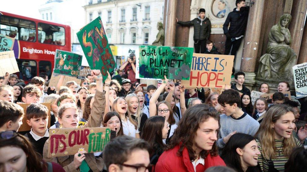 Schoolchildren take part in a student climate march on February 15, 2019 in Brighton, England.