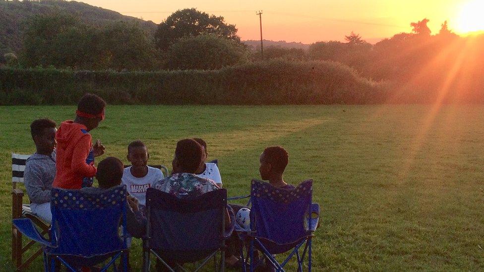 Children camping in a field