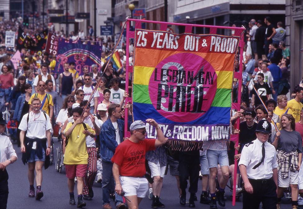 People attend the Pride march in 1995