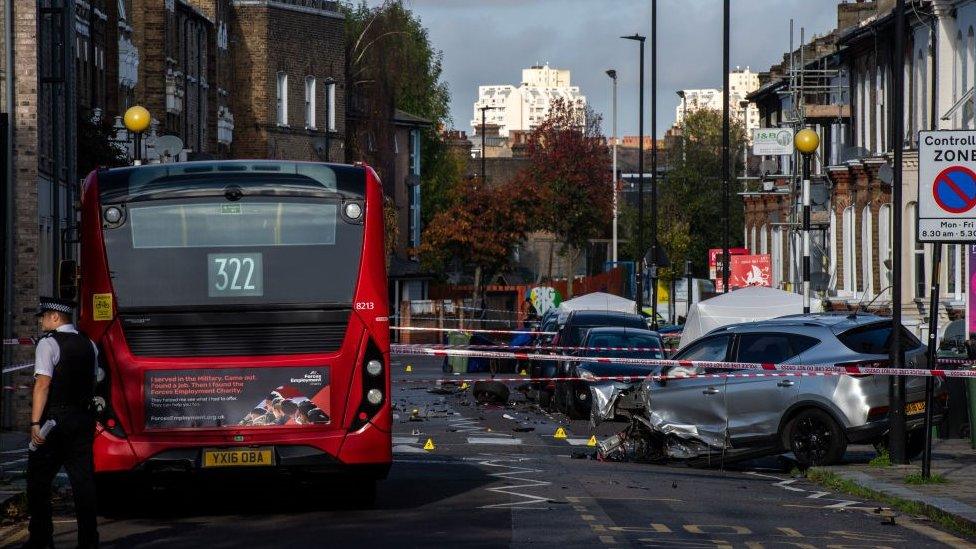 Scene of the incident showing bus and destroyed car