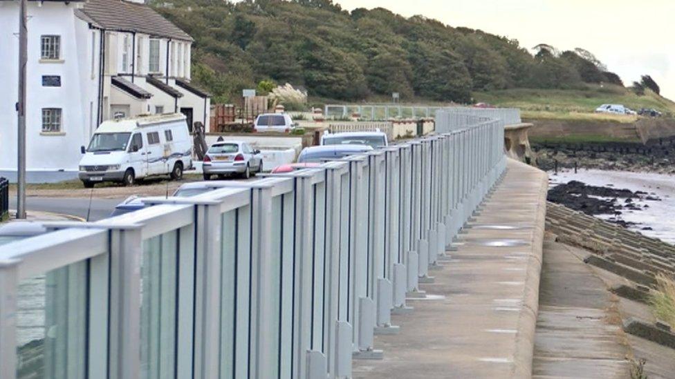 Glass wall along a promenade