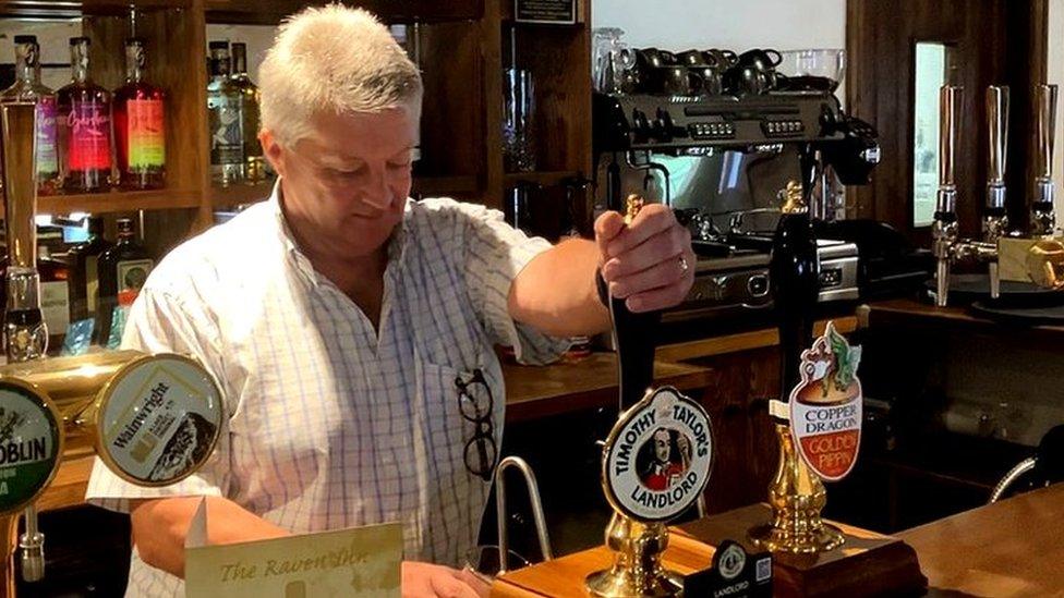 Bob Eden pulling a pint at The Raven Inn