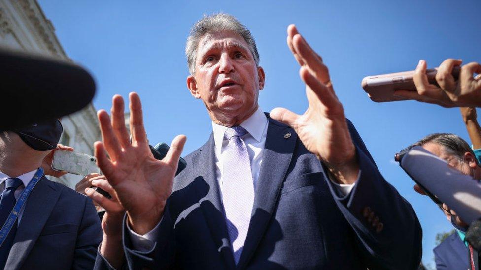 Joe Manchin speaks to reporters in 2021