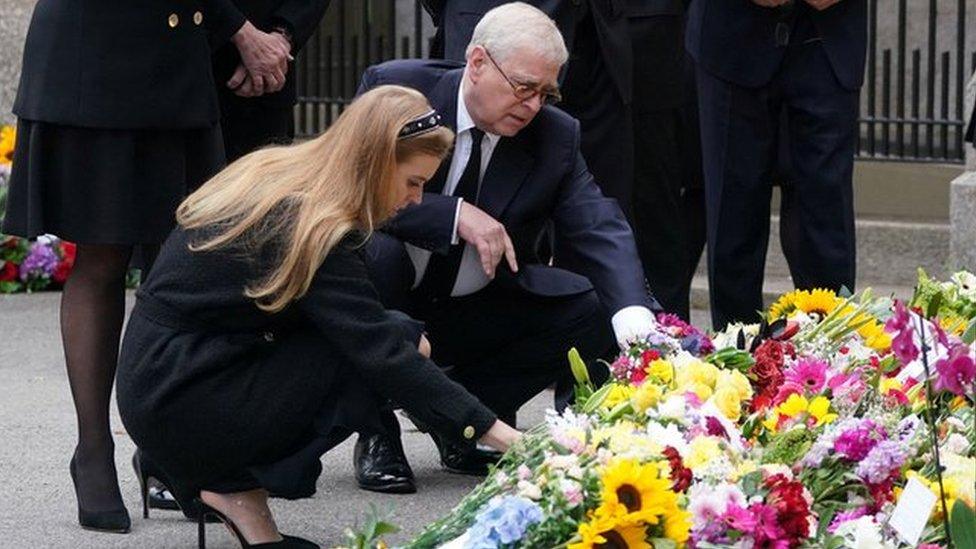 Princess Eugenie, Peter Phillips, Vice Admiral Sir Timothy Laurence, Zara Tindall, Princess Beatrice and Prince Andrew, Duke of York view the messages and floral tributes left by members of the public, following the passing of Britain's Queen Elizabeth, in Balmoral, Scotland