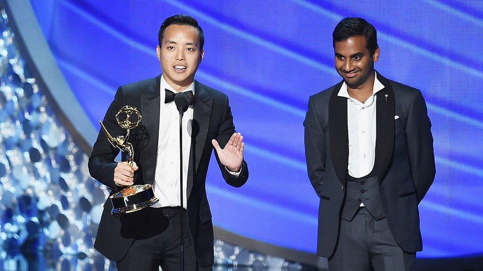 Actor/writer Aziz Ansari (R) and writer Alan Yang (L) accept Outstanding Writing for a Comedy Series for the 'Master of None' episode 'Parents' onstage