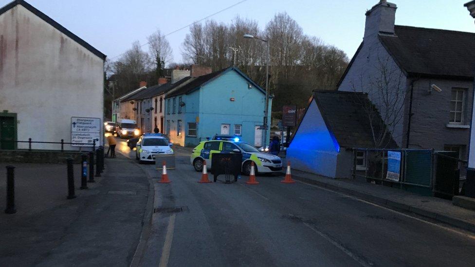 A police car blocks a road in Cardigan