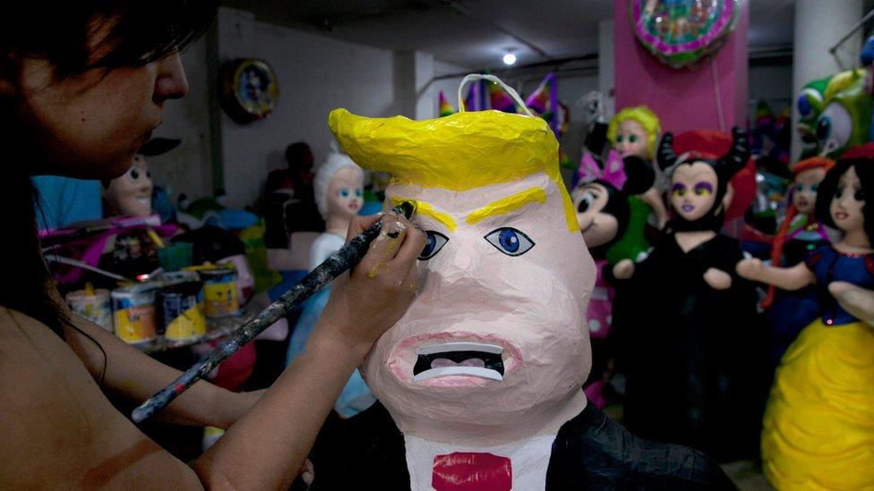 A Trump pinata being painted at a shop in Mexico City - July 2015