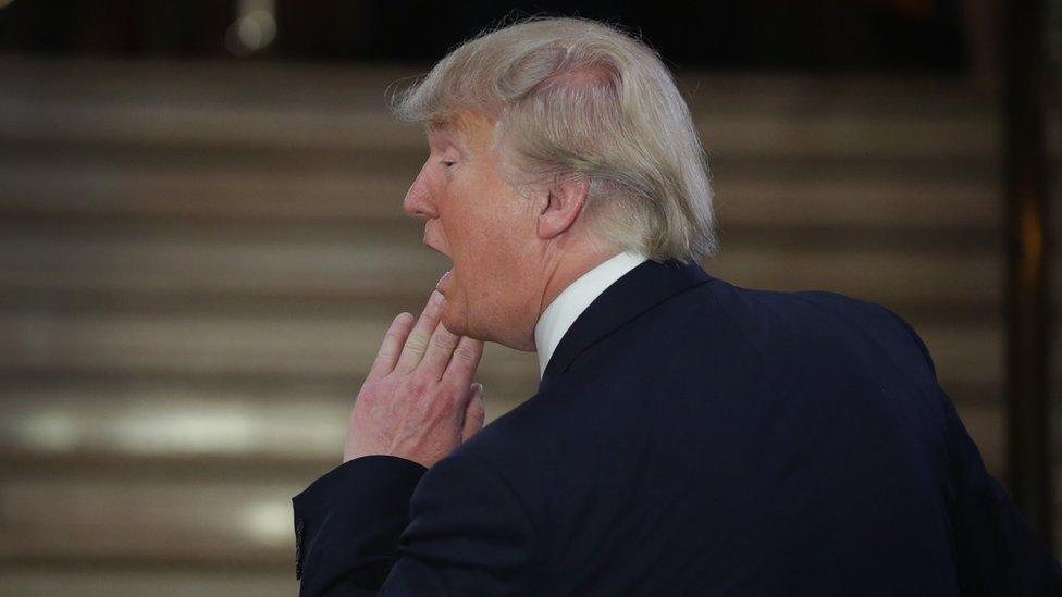 Republican presidential candidate Donald Trump greets reporters in the spin room following a debate sponsored by Fox News at the Fox Theatre on March 3, 2016 in Detroit, Michigan