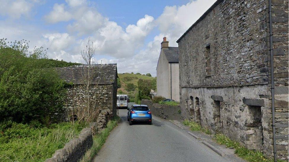 A road passes through a farm