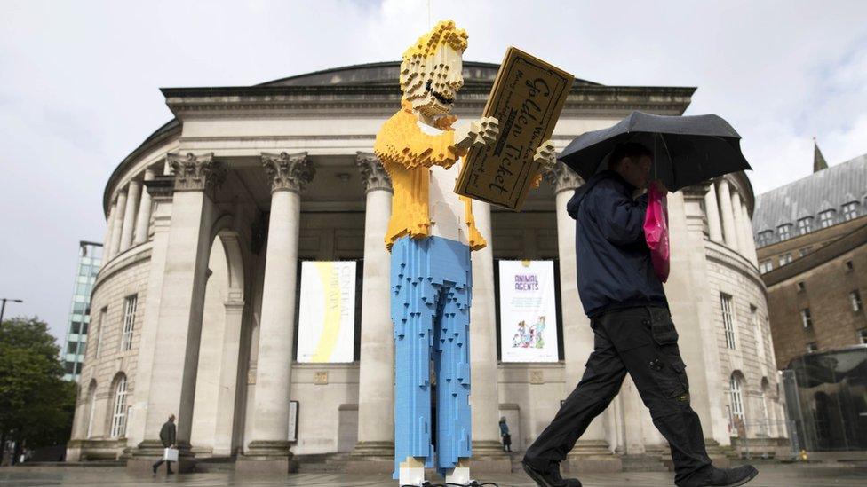 A Lego version of Charlie outside Manchester Central Library