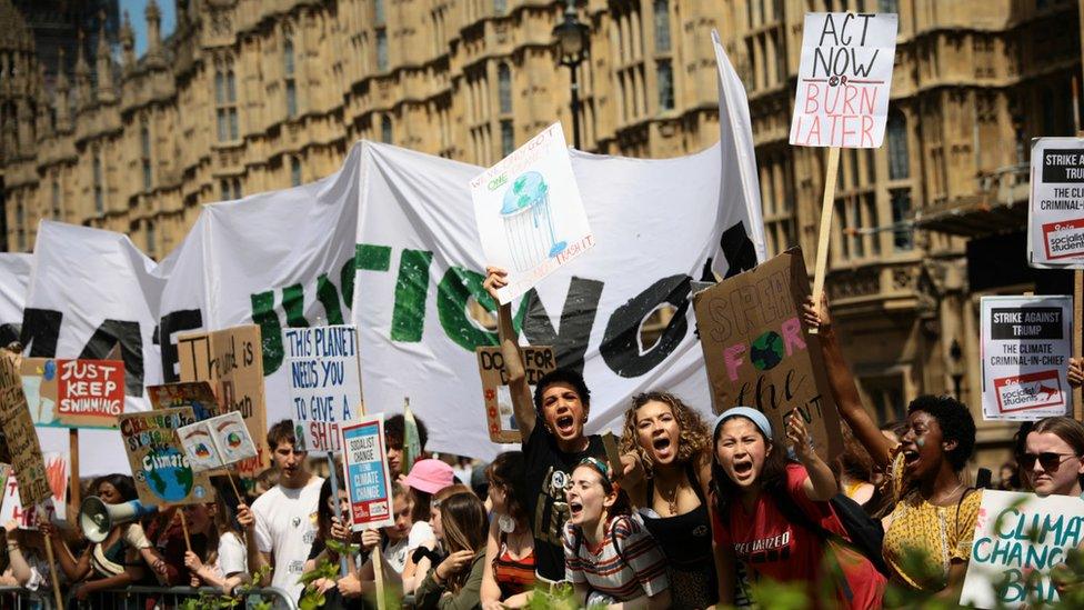 Students take part in a climate rally in Parliament Square